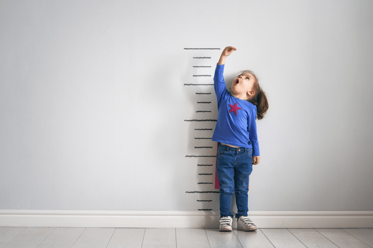 Child measuring their own height